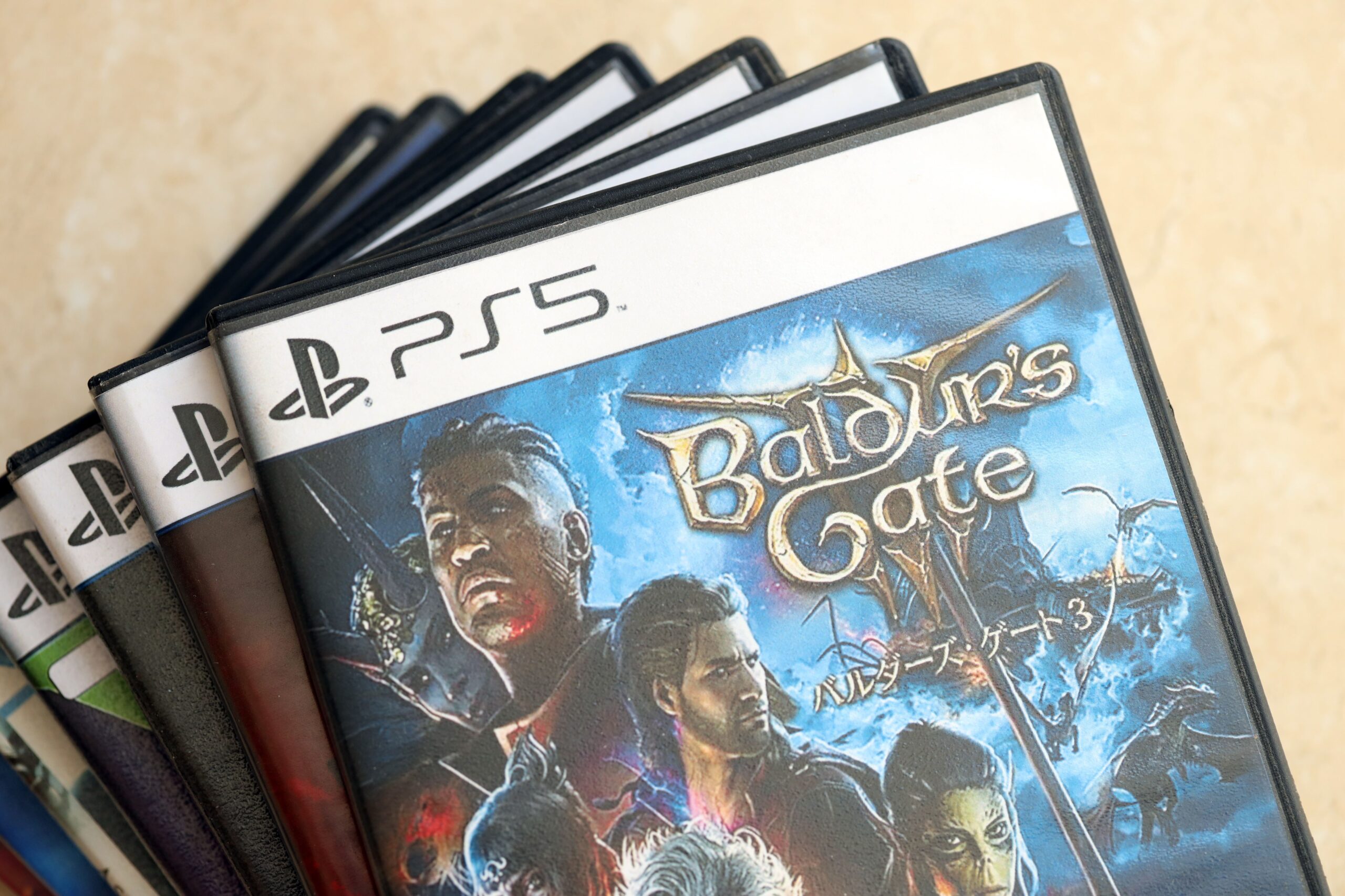 Stack of PS5 games with Baldur