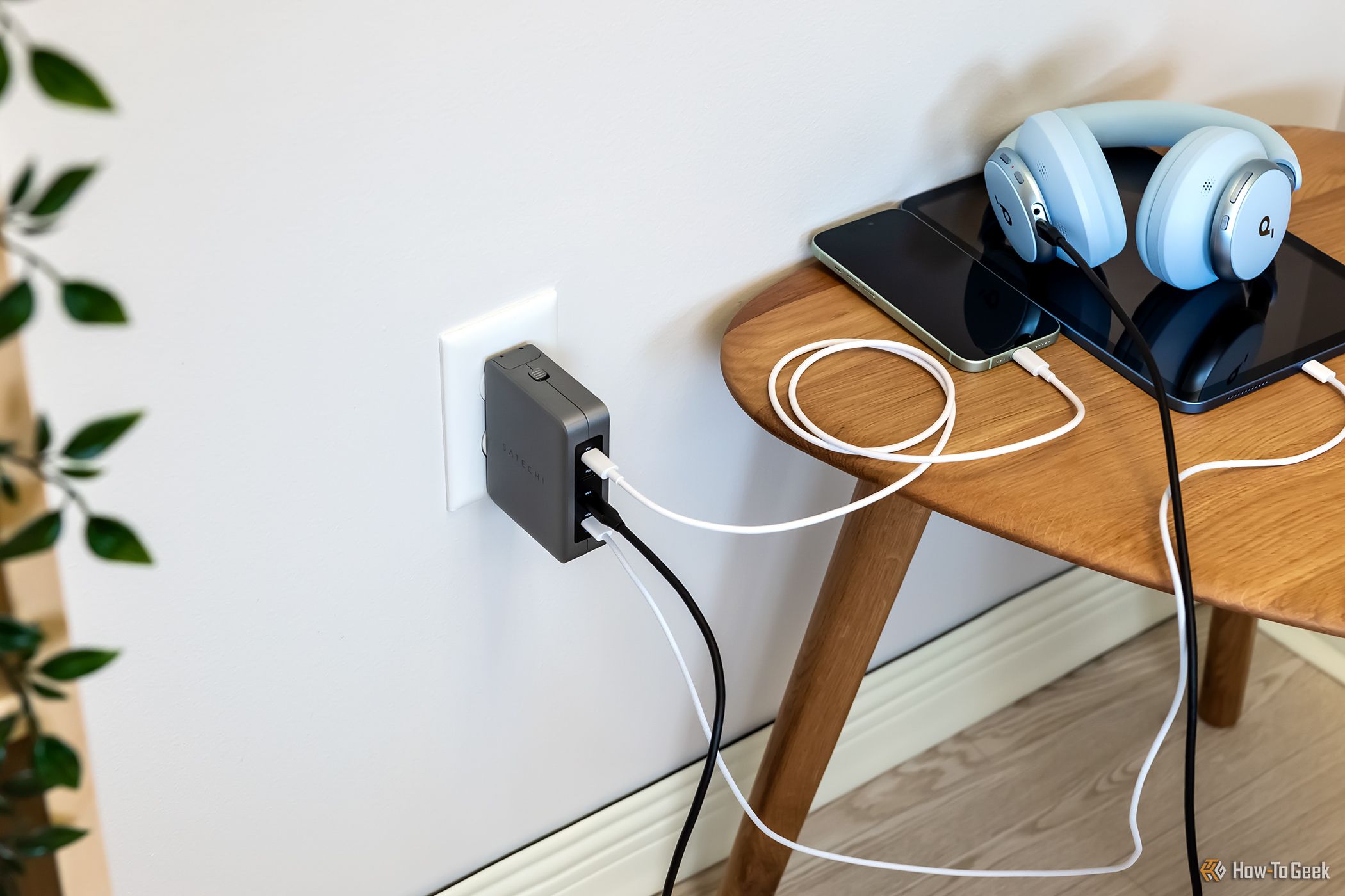Charging multiple devices with the Satechi 145W USB-C 4-Port GaN Travel Charger.